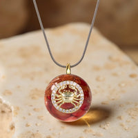 Pendentif en orgonite "Signe astrologique" en éclats de pierre 2
